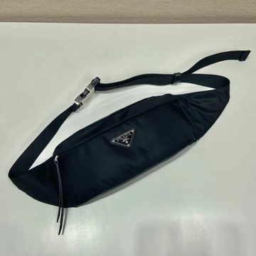 Slim black nylon sling bag with a long adjustable strap
