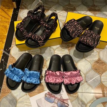 Four padded slide sandals with printed and ruffled satin straps