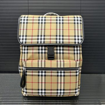 Beige check-pattern backpack with a buckled flap and a zipped front pocket