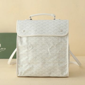 White squared backpack with a top handle and an all-over printed pattern, beside its box