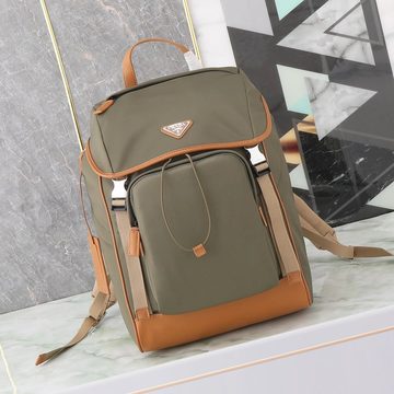 Olive nylon backpack with tan trim and a zipped front pocket