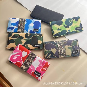 Five long wallets in blue, green, brown and pink camouflage prints