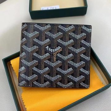 Dark patterned bifold wallet with painted lettering, in a green gift box