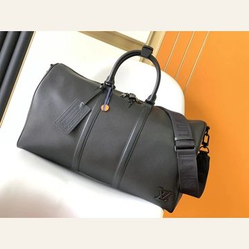 Dark grey smooth holdall with a luggage tag and shoulder strap