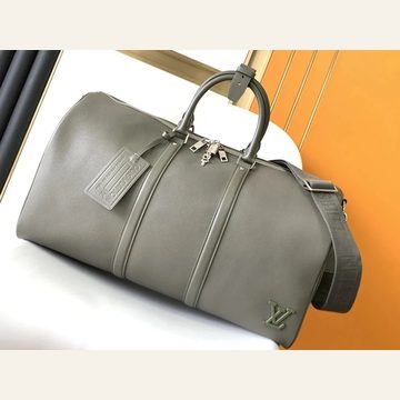 Grey-green smooth holdall with a luggage tag